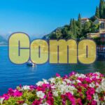 Lago di Como in autunno, vista panoramica con colori caldi e pochi turisti.